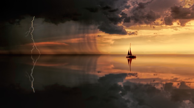 boat floating in stormy seas