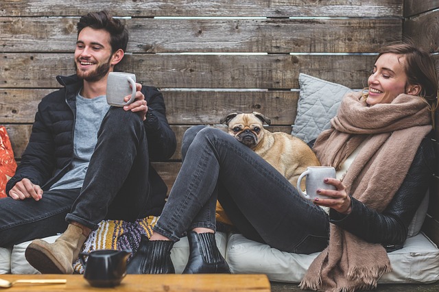 happy couple with pug